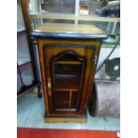 A modern mahogany effect cabinet with glazed door