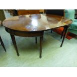 A Georgian mahogany dinning table with centre leaf