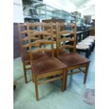 A set of four modern rail back pine dinning chairs