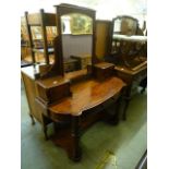 A Victorian mahogany dressing table having a swing mirror to back with trinket drawers