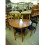 A Formica drop leaf table together with a pair of black rexine upholstered chairs and pair of green