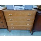 A mid-20th century oak chest of four long drawers