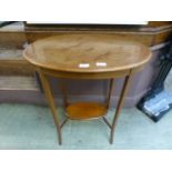 An Edwardian fiddle back mahogany topped and boxwood strung occasional table with under tier