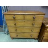 A Victorian mahogany chest of two short over three long drawers with turned handles