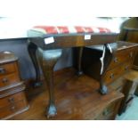 An 18th century style walnut stool on cabriole legs with ball and claw feet