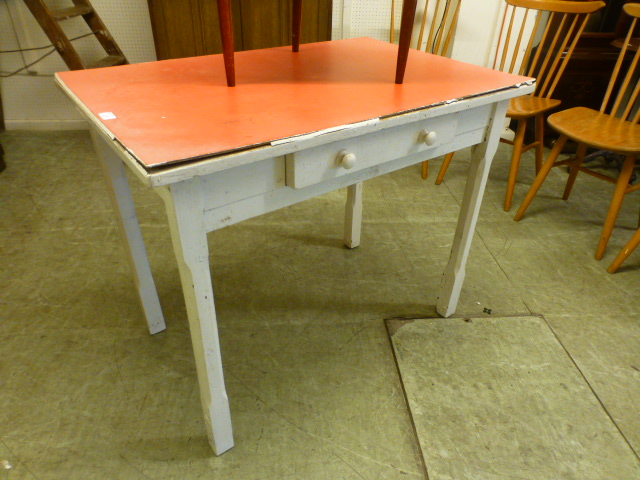 A red Formica topped single drawer table with white base