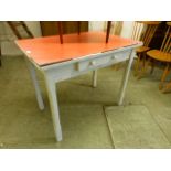 A red Formica topped single drawer table with white base