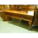 A 1970s walnut veneered record player cabinet