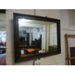 An early 20th century oak framed mirror