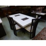 An Italian style marble dining table with contrasting marbles along with a set of six stained ash
