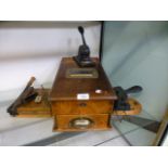 An early 20th century mahogany manual operated shop till together with scales, guillotine,