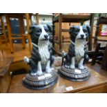 A pair of cast metal door stops in the form of dogs
