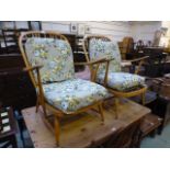 A pair of Ercol open arm easy chairs