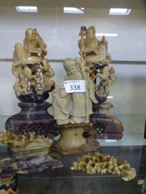A selection of oriental soapstone carvings