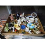 A selection of collectable miniature ceramic ware to include egg cups, pigs, figurines etc.