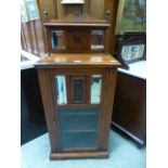 An early 20th century walnut display cabinet,