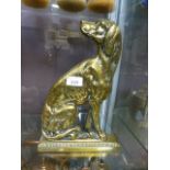 A brass doorstop in the form of dog