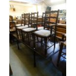 A reproduction oak effect extending dining table along with a set of six (2+4) chairs