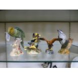 A collection of four Beswick models of birds comprising of a Parakeet (No.