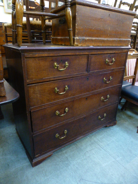 A Georgian mahogany chest of two short over three long drawers