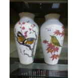 A pair of white ceramic Japanese bird and leaf design vases from the Franklin porcelain company