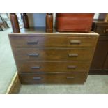 A mid 20th century oak chest of four long drawers