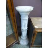 A marble jardiniere stand