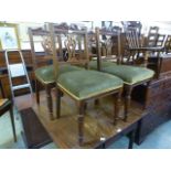 A set of four walnut framed Edwardian dining chairs,