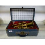 A brass trumpet in carrying case