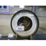 A gilded metal circular barometer
