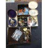 A box containing an assortment of costume and other jewellery to include brooches, beads etc.