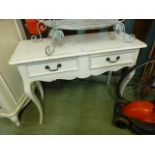 A cream painted two drawer console table