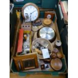 A tray containing clocks, barometers, storage boxes etc.