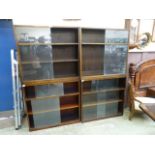 Four mid-20th century oak bookcases with glazed sliding doors