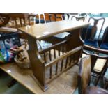 A modern oak occasional table with magazine rack beneath