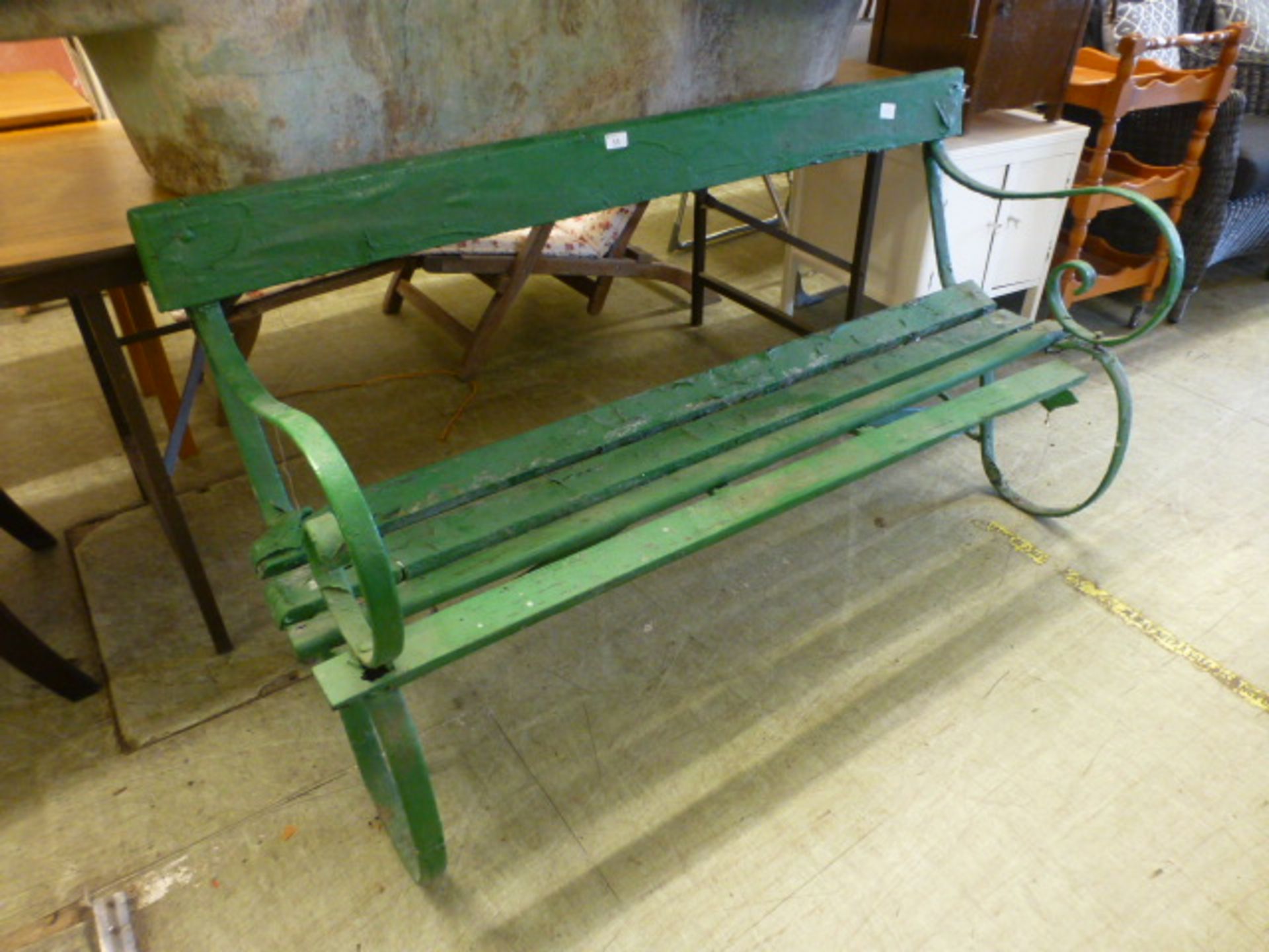 A wrought metal and green painted garden bench A/F