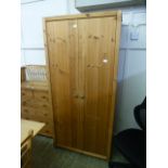 A pine two door wardrobe