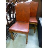 A pair of oak framed red fabric upholstered dinning chairs