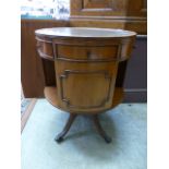 A reproduction mahogany circular bookcase,