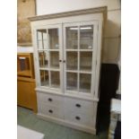 A modern cream crackle effect cabinet having a pair of glazed doors above a bank of four drawers