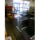 Three metal framed and glass topped tables