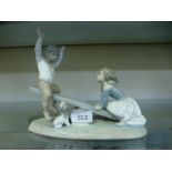 A Lladro model of children on seesaw