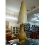 A mid-20th century design ceramic table lamp with a tall fluted shade