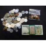 A bag containing an assortment of foreign currency to include coins and banknotes