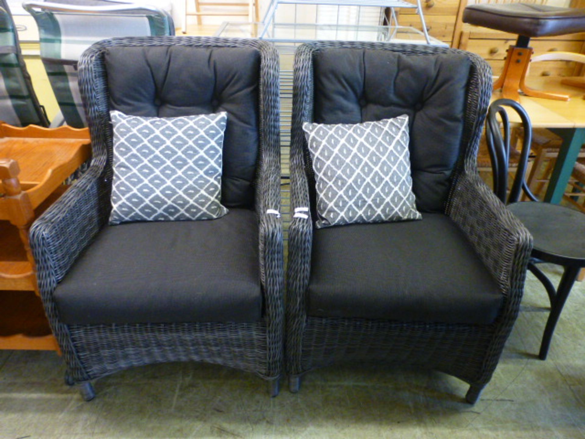 A pair of grey wicker and cushioned garden chairs CONDITION REPORT: Generally good