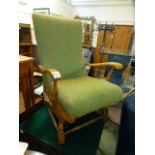 An early 20th century American style rocking chair beech framed rocking chair