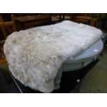 A synthetic sheepskin style rug