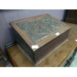 A 19th century oak box with carved lift up top