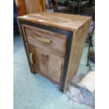 An eastern hardwood cabinet having a single drawer above cupboard door