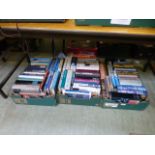 Three trays of hardback books on various subjects